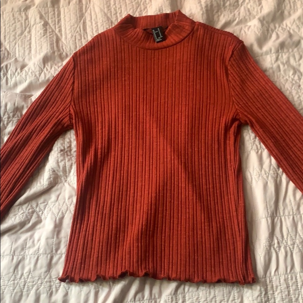 A turtle neck long sleev shirt
